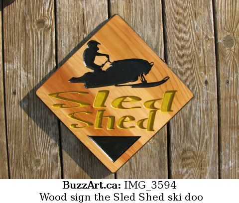 Wood sign the Sled Shed ski doo